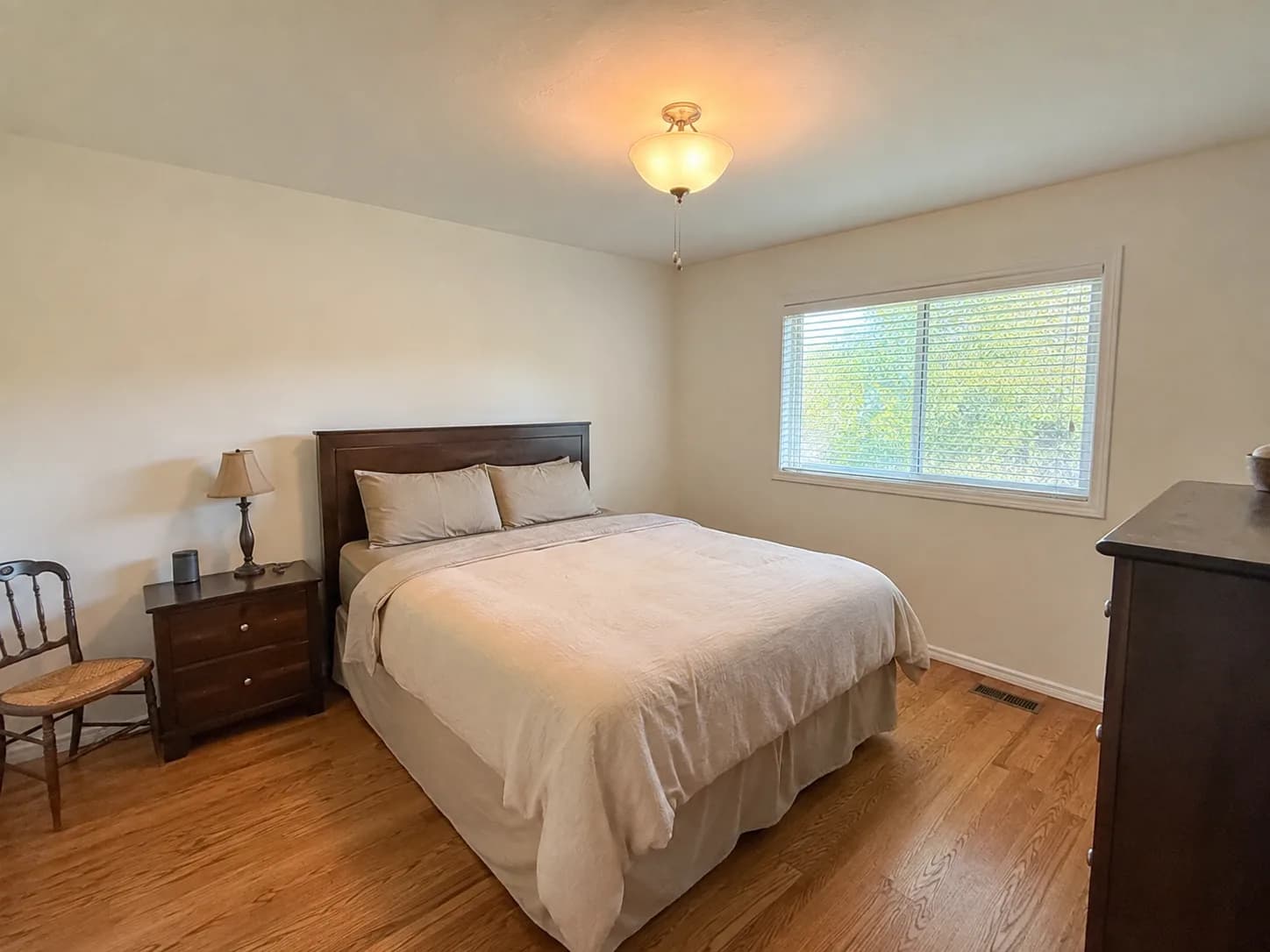 Plain bedroom before an AI interior redesign