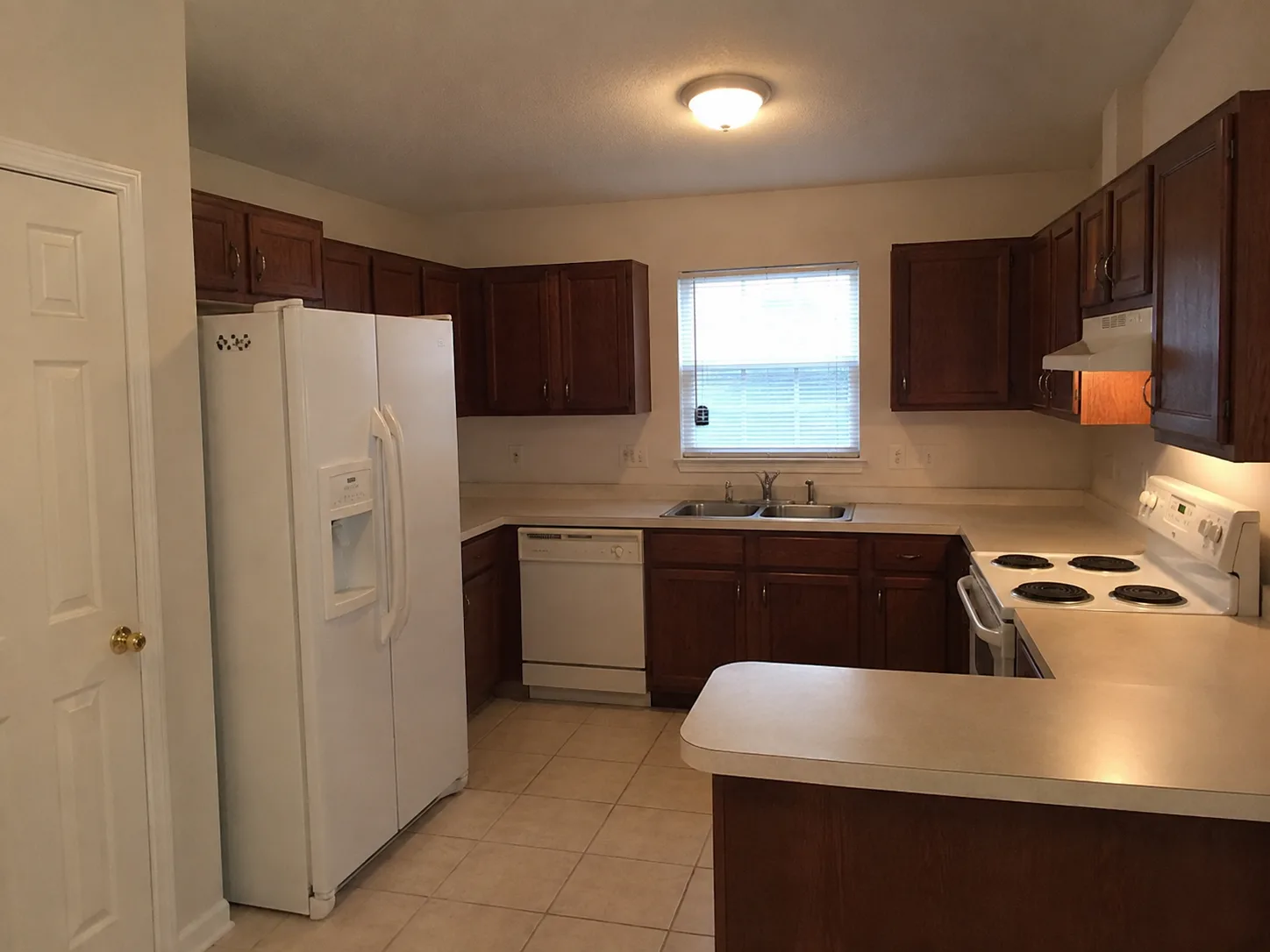 Dark traditional kitchen before an AI redesign